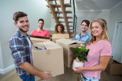 Professional house removalists carefully packing items