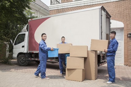 Charity volunteers receiving donated household items from Movers Europe