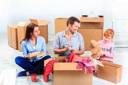 Moving team using PPE while loading a van