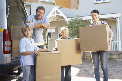 Professional movers assisting with packing